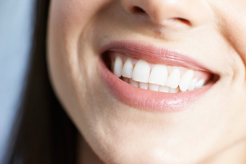 Close Up Of Woman With Beautiful Teeth And A Perfect Smile