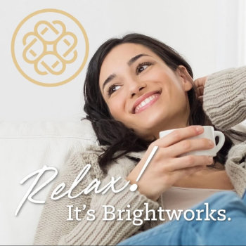 A woman smiles while holding a mug and reclining on a couch. "Relax! It’s Brightworks." text is displayed, with a decorative logo in the top left corner.