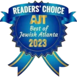 Blue and gold badge with "READERS' CHOICE," "AJT Best of Jewish Atlanta 2023" text and ribbon graphics.