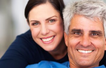 happy loving middle aged couple relaxing at home