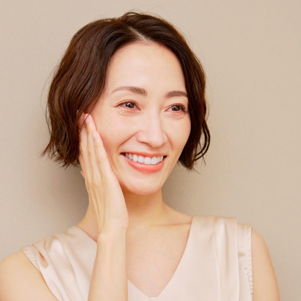 Portrait of a middle aged woman on a brown background