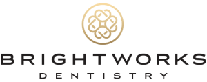 Brightworks Dentistry logo with a gold circular geometric design above the company name in black capital letters.